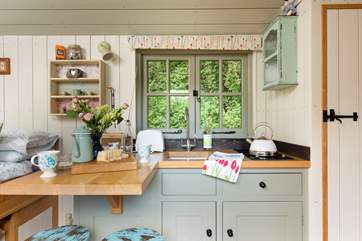 The kitchen is well-equipped with everything you'll need for your glamping getaway.
