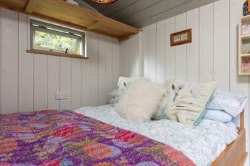 The cosy bed promises a peaceful night's sleep.