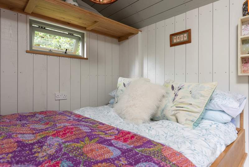 The cosy bed promises a peaceful night's sleep. 
