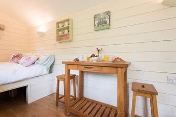 There is a little table and chairs for dining inside the hut and a patio table and chairs outside too.