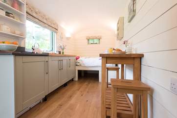 The hut has a lovely outlook over the open orchard garden.