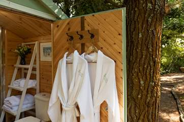 The shower cabin is just a few steps away and has a double shower, wash-basin and proper flushing toilet.
