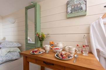 There is a little table and chairs for dining inside the hut and a patio table and chairs outside too.