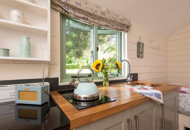 The kitchen is well-equipped for your glamping getaway. 