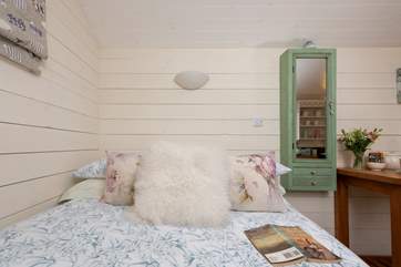The cosy double bed with comfortable deep mattress awaits.