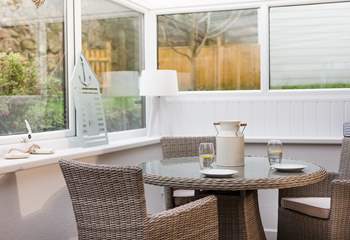 The sun-room overlooks your private garden.