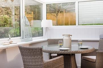 The sun-room overlooks your private garden.