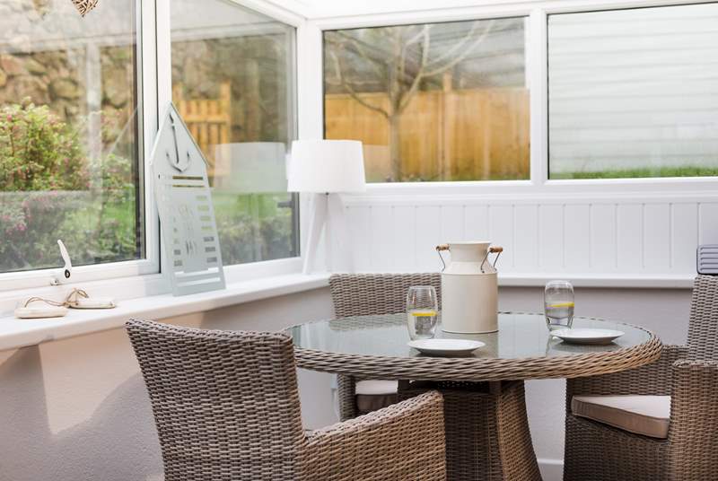 The sun-room overlooks your private garden.