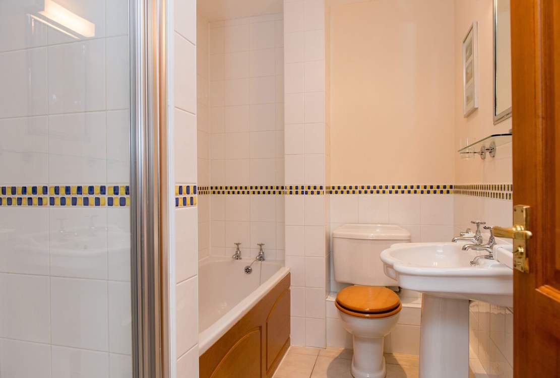 The family bathroom has a separate shower.