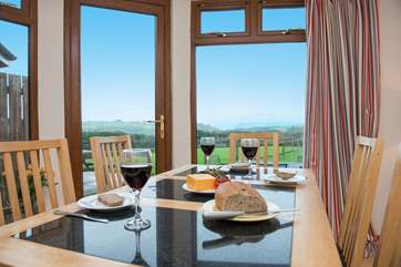 From the dining-area you can look out across the garden and take in the far reaching views of the sea.