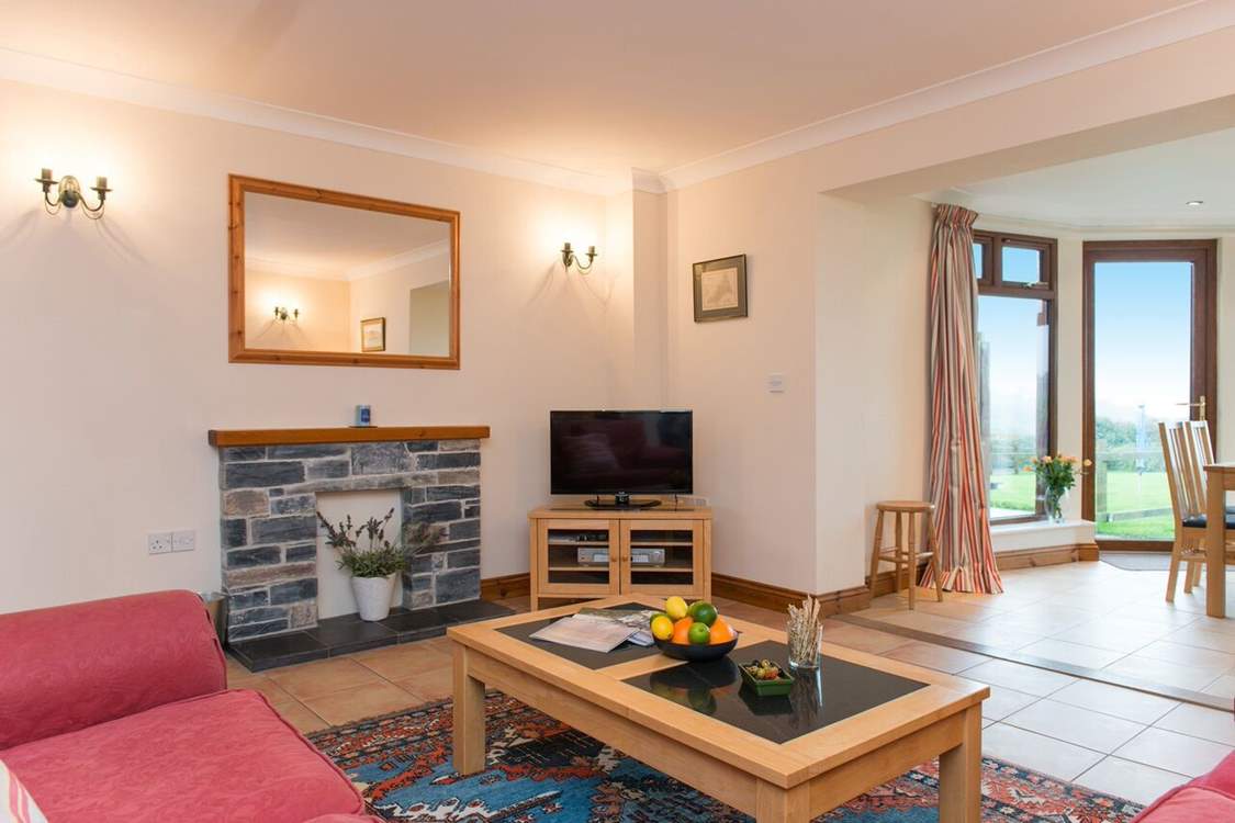 Open plan sitting and dining with friends and family.