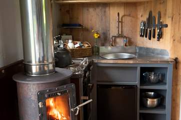 There is a an electric grill and mini oven and a two ring has hob and fridge all clevery designed to fit in.