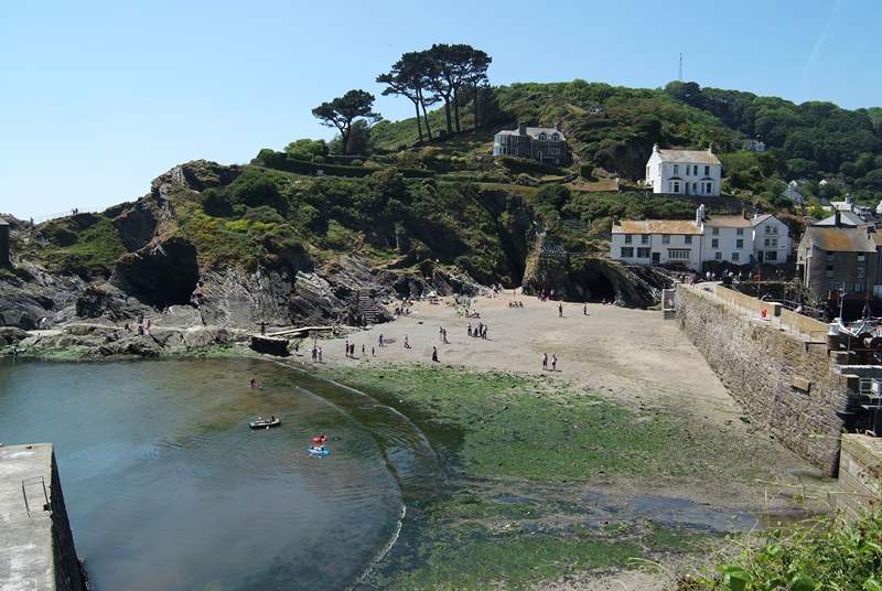 The little beach at Polperro appears at low tide. 
