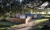 The driveway leading down to the totally enclosed patio at the front of the cottage (you can just see the play area behind). - Thumbnail Image