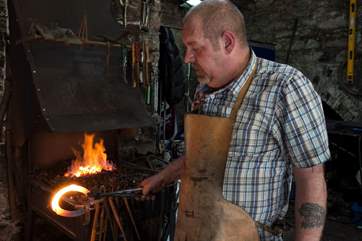 A blacksmith has a forge in the Barrow Centre.