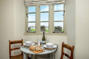 The pretty dining-area enjoys the views across the water.