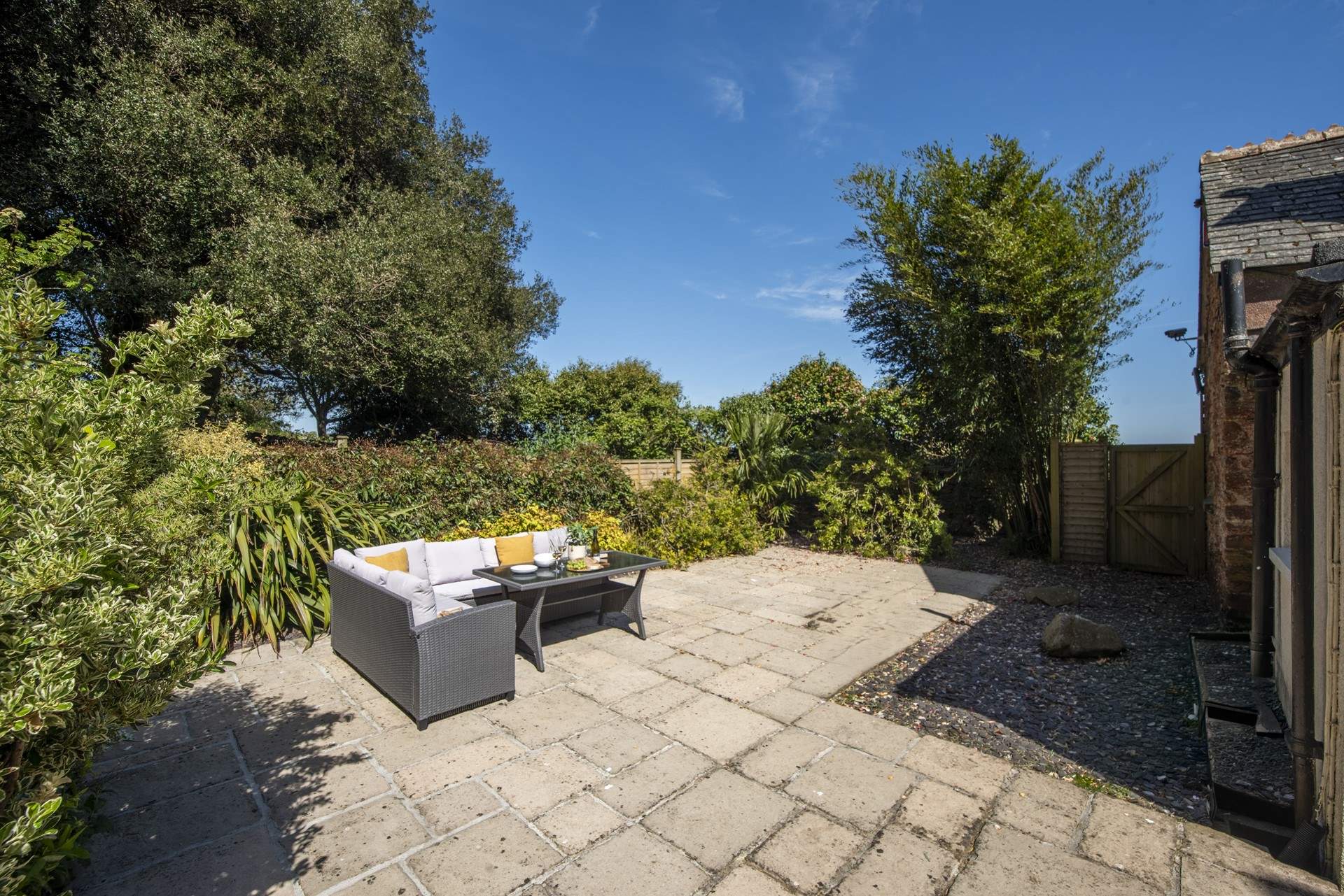 The large patio is the perfect place for leisurely dining and lounging in the sunshine.