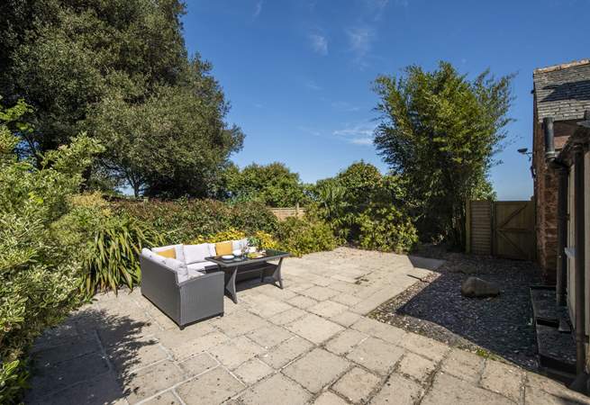 The large patio is the perfect place for leisurely dining and lounging in the sunshine.