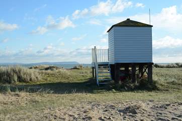 From Mudeford Sandbank, the other side of the harbour entrance, a view of the Isle of Wight in the distance.