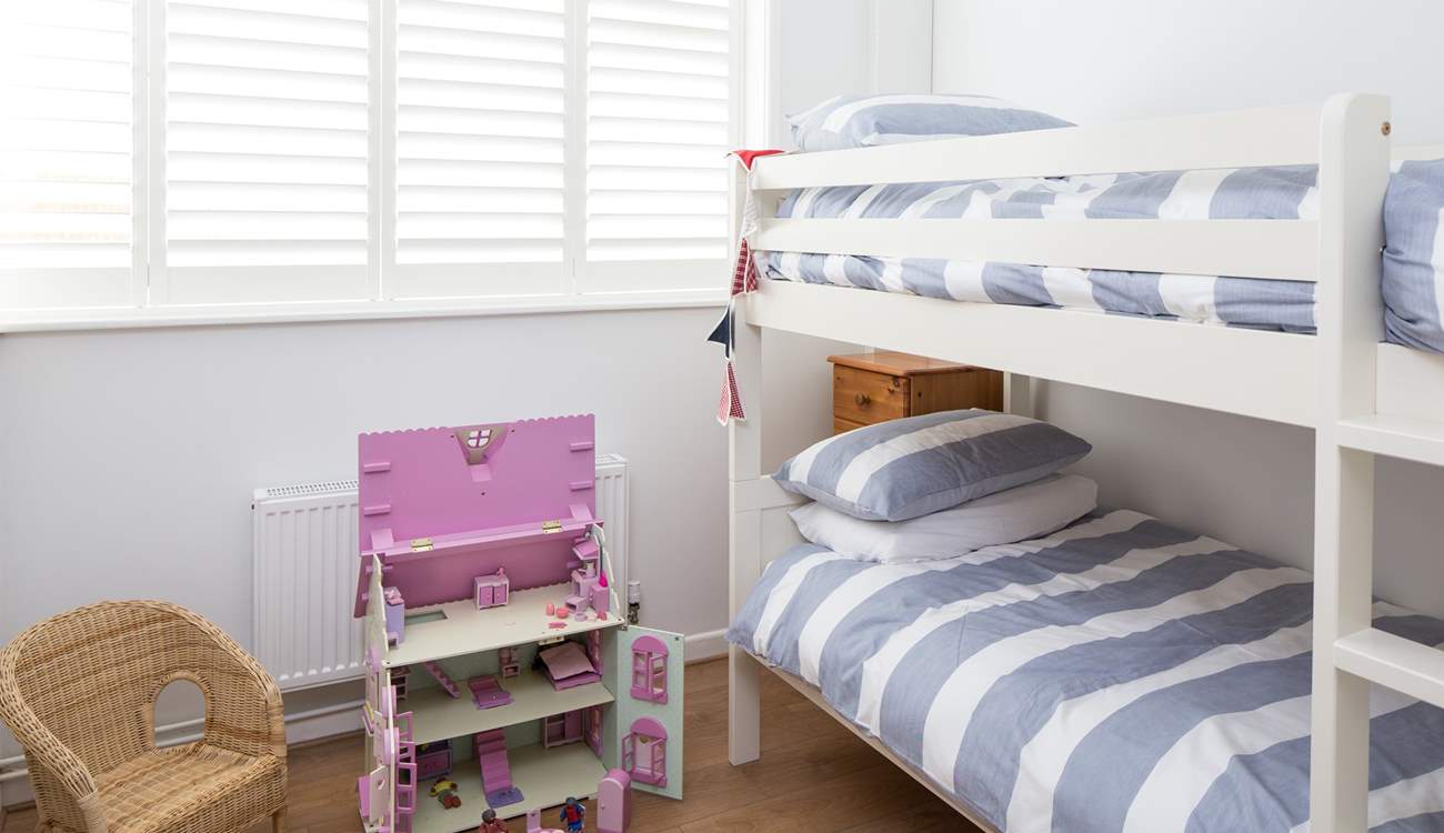The cheerful children's room, bedroom 3, has 3ft bunk-beds and a beautiful doll's house to play with.