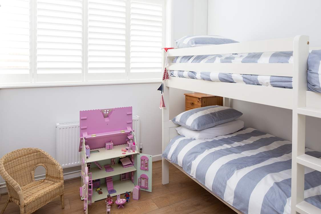 The cheerful children's room, bedroom 3, has 3ft bunk-beds and a beautiful doll's house to play with.