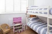 The cheerful children's room, bedroom 3, has 3ft bunk-beds and a beautiful doll's house to play with.