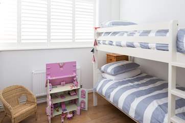 The cheerful children's room, bedroom 3, has 3ft bunk-beds and a beautiful doll's house to play with.