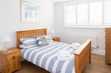 Bedroom 2 has a comfy 4ft 6in bed and plenty of space with built-in wardrobes,