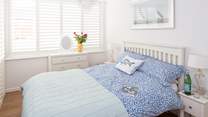 The main bedroom has a super comfy 4ft 6in bed and gorgeous linens. The small en suite and a further door separates this room from the other bedrooms.
