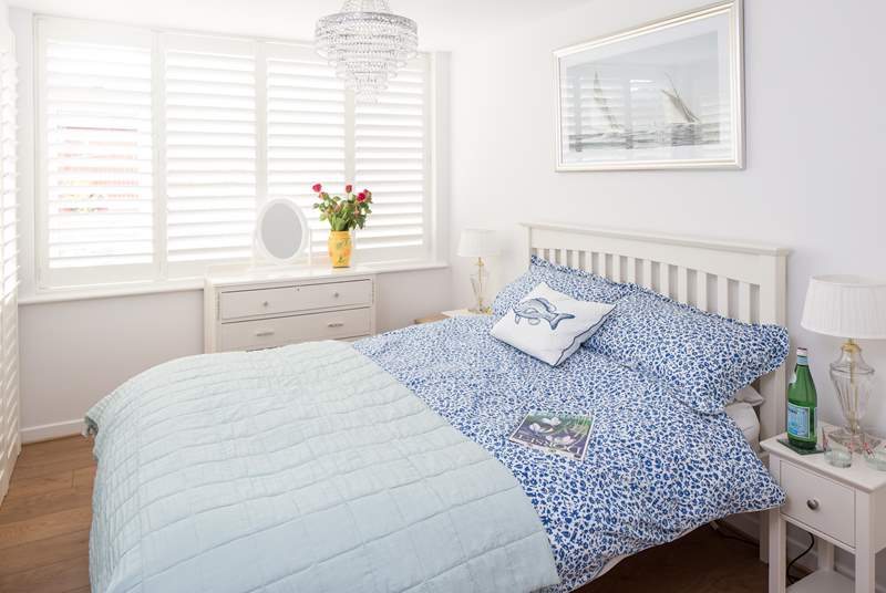 The main bedroom has a super comfy 4ft 6'' bed and gorgeous linens. The small en suite and a further door separates this room from the other bedrooms.