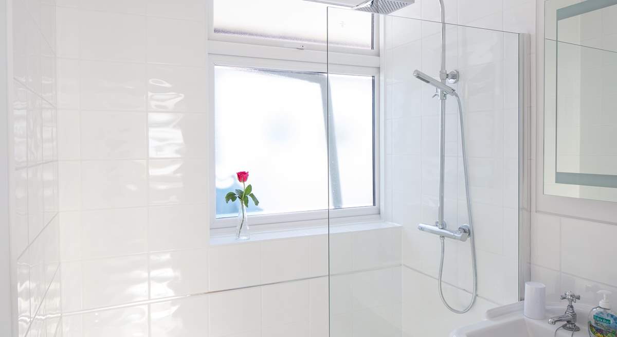 The family bathroom has a large shower with drench head.