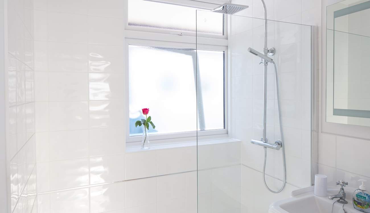 The family bathroom has a large shower with drench head.