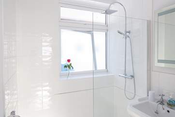 The family bathroom has a large shower with drench head.