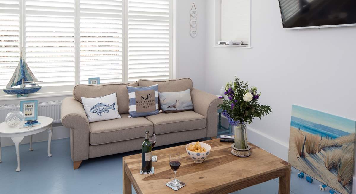 The open plan living-room is filled with light and has stylish plantation shutters. There is a Sonos Bluetooth system, so you can have music to relax to or watch the Smart TV which is Netflix enabled.