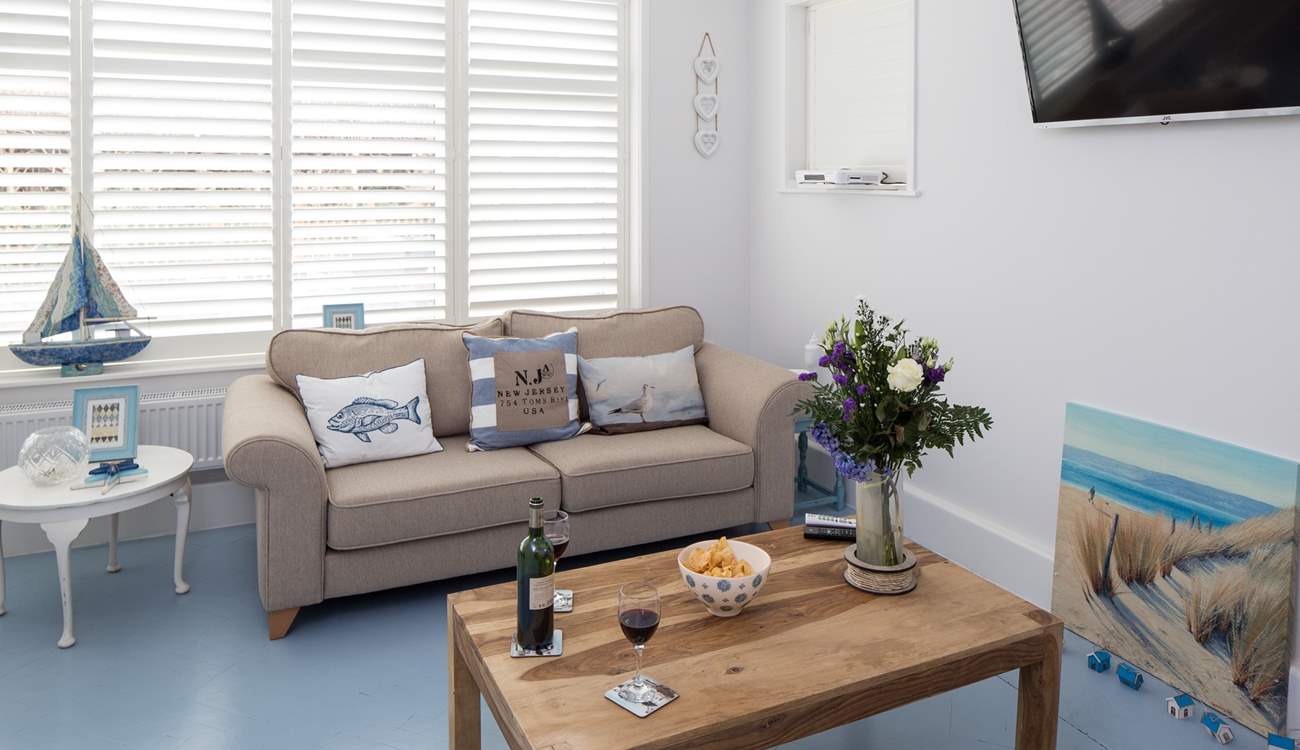 The open plan living-room is filled with light and has stylish plantation shutters. There is a Sonos Bluetooth system, so you can have music to relax to or watch the Smart TV which is Netflix enabled.