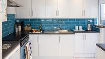 The modern kitchen has a gas hob and double electric oven, all you need to create a decadent holiday meal.