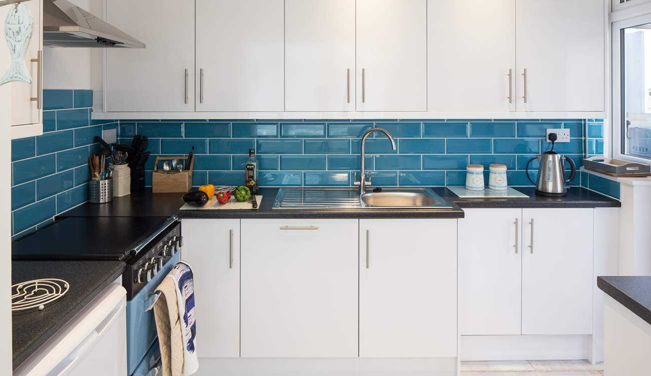 The modern kitchen has a gas hob and double electric oven, all you need to create a decadent holiday meal.