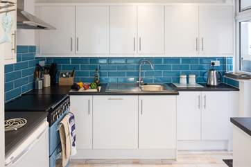 The modern kitchen has a gas hob and double electric oven, all you need to create a decadent holiday meal.
