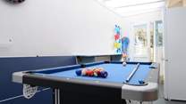 The utility/games-room is not heated but provides lots of extra storage space and room for children to play. Note that the pool table is now an air hockey table, (new picture to follow).