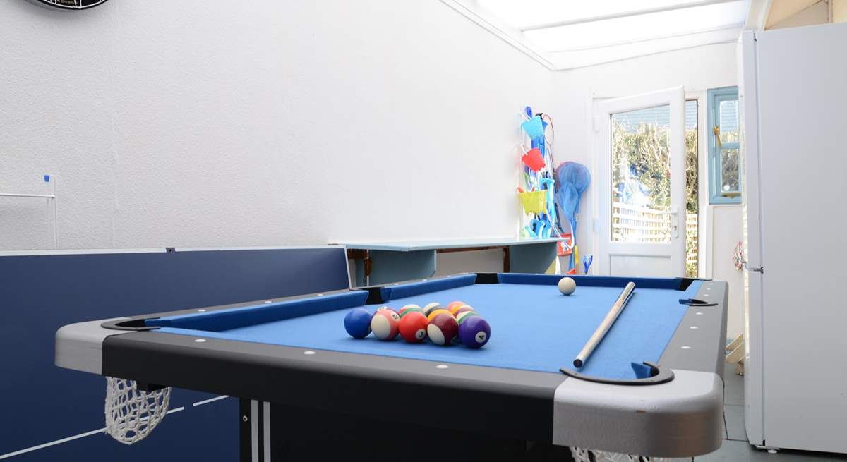 The utility/games-room is not heated but provides lots of extra storage space and room for children to play. Maybe a family pool challenge?