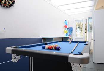 The utility/games-room is not heated but provides lots of extra storage space and room for children to play. Maybe a family pool challenge?