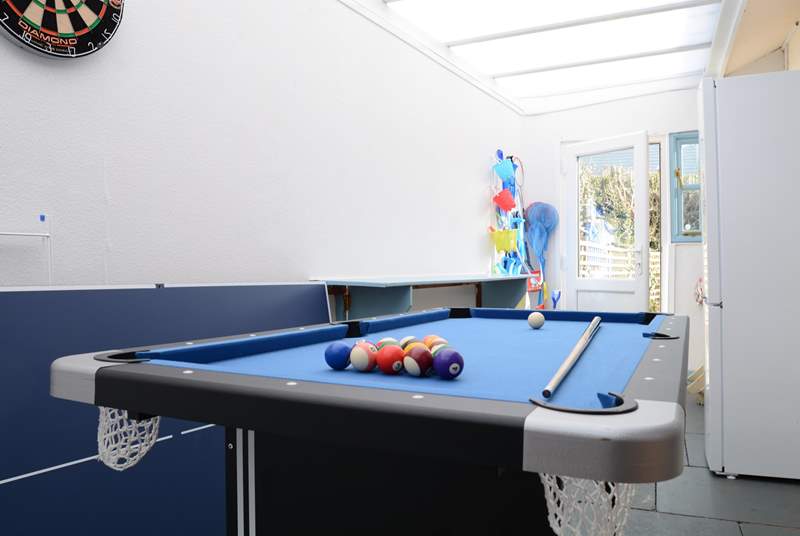 The utility/games-room is not heated but provides lots of extra storage space and room for children to play. Maybe a family pool challenge?