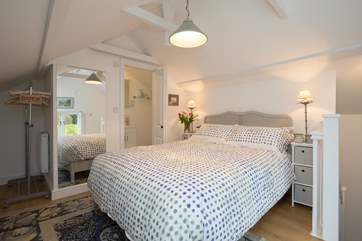 Looking across the bedroom from the other direction. There is a petite en suite shower-room fitted into the far corner.