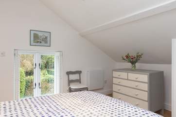 Lie in bed and look out over the gardens across the lane.