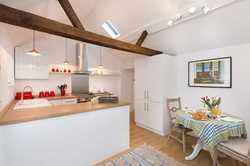 The kitchen is designed to separate the two functions of the room but keeping that sense of space at the same time.