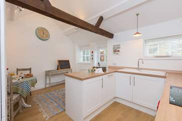 The front door from the parking-area opens into the kitchen/dining-room. There is so much space here and the double height room adds to that.