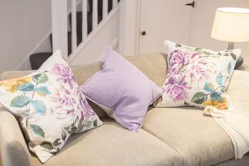 The are soft colours and patterns throughout the cottage.