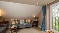 The first floor sitting-room makes the most of the fantastic valley views from the balcony.