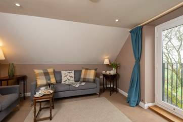 The first floor sitting-room makes the most of the fantastic valley views from the balcony.