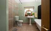 The ground floor bedroom has this en suite bathroom with separate shower cubicle. - Thumbnail Image